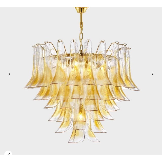 This extraordinary chandelier, designed and produced by Mazzega, is a true expression of 1970s Italian design. The gold-...