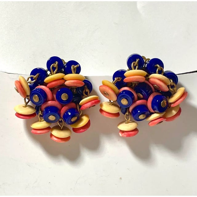 This is part of Chairish’s Costume Jewelry assortment. These earring move to the movement. Cool 1950s swirl earrings make...