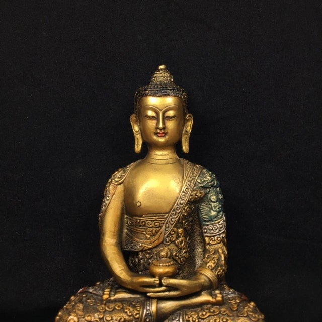 This exquisite vintage sculpture depicts Shakyamuni Buddha seated in deep meditation upon an ornate double-lotus base....
