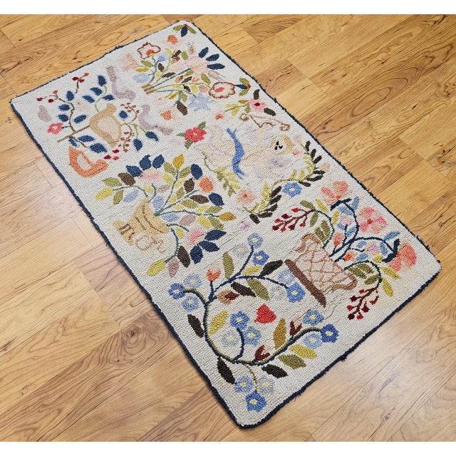 Vintage Claire Murray hand hooked pictorial rug. The rug has a delightful design and colors. The rug has an ivory color...