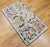 Vintage Claire Murray hand hooked pictorial rug. The rug has a delightful design and colors. The rug has an ivory color...