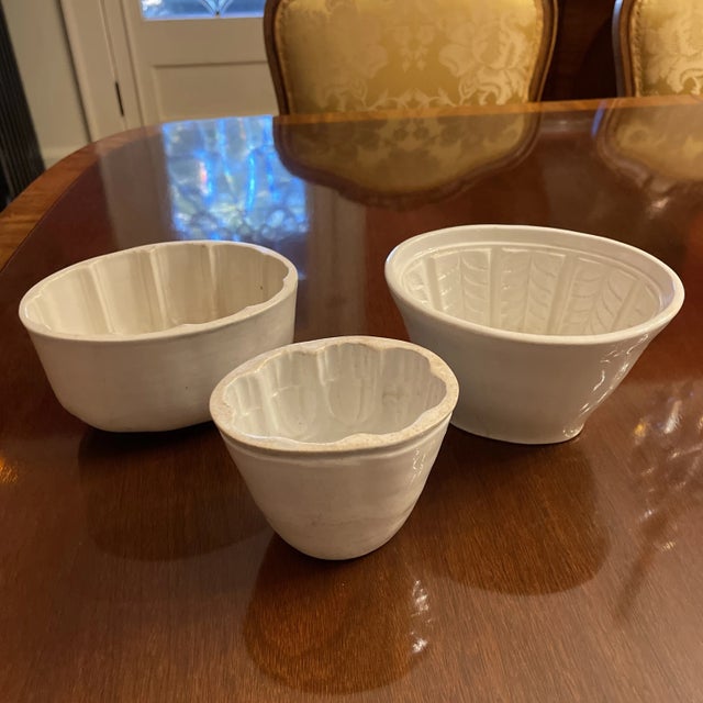 Set of 3 - graduated English Ironstone white creamware glazed pudding or jelly moulds. With ornate Victorian designs,...