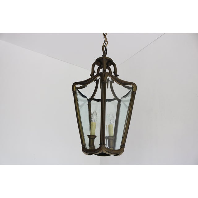A superb and somewhat larger Edwardian Jugendstil hall pendant lantern, circa 1910. The heavy bronze frame is designed...