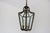 A superb and somewhat larger Edwardian Jugendstil hall pendant lantern, circa 1910. The heavy bronze frame is designed...
