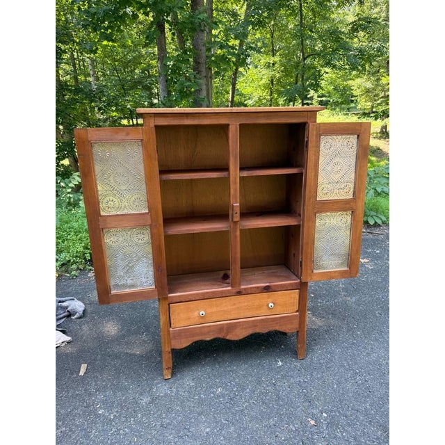 Vintage Early American Primitive Rustic Style Pie Safe Cabinet With Punched Tin Front Panels. Solid wood frame, sturdy...