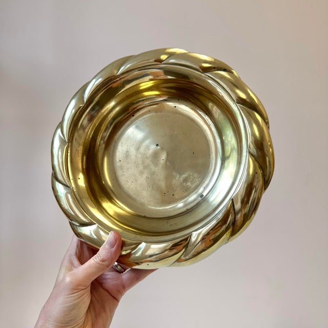 A beautiful vintage solid brass catchall dish, with a twisted rope-style border. A gorgeous table top accessory, perfect...