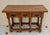 Handsome Spanish console table crafted in solid wood, featuring three drawers with original iron ring pulls, beautifully...
