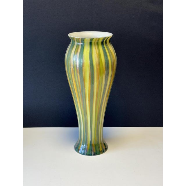 This is a blown glass, hand-shaped piece of art. The exterior is finished in embossed glass in a combination of shades of...