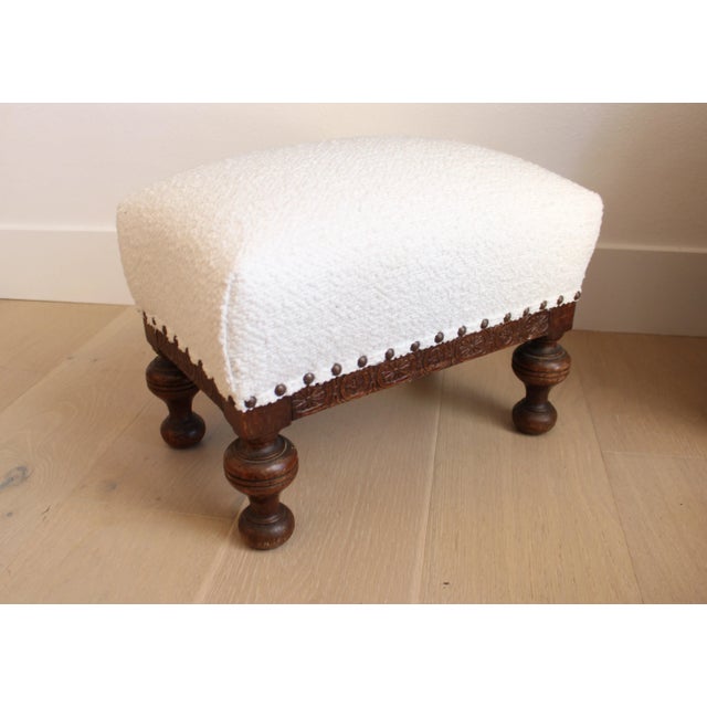 Early 20th Century carved footstool made in the grand Louis XV taste from France. The stool features newly upholstered...