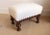 Early 20th Century carved footstool made in the grand Louis XV taste from France. The stool features newly upholstered...