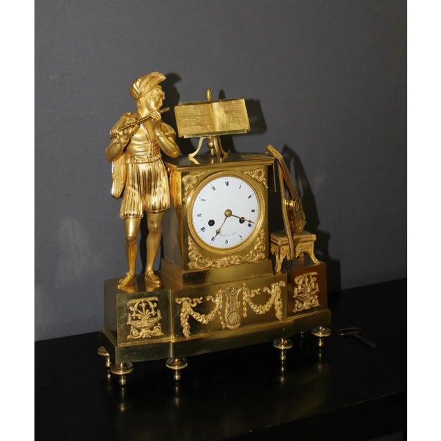Troubadour clock in original gilded and chiseled bronze, wire movement signed Beaullier in Paris, the movement has been...