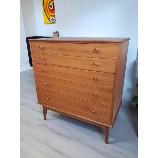A superb mid-century chest of drawers by renowned british furniture designer alfred cox, crafted in the 1950s and retailed...