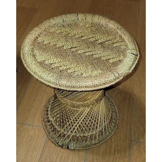 Add natural charm to your home with this small circular plant stand, crafted from rattan, wicker, and bamboo. Lightweight...