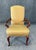 This elegant arm chair features a warm gold patterned upholstery that provides both comfort and refined visual texture,...
