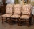 This set of six French dining chairs brings immediate warmth and texture to a room, combining classic Louis XIII form with...