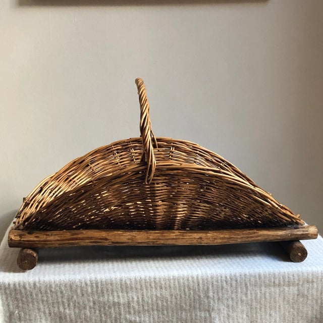 Offering a beautiful antique gathering basket uniquely mounted on a sturdy wood frame. Although I am not certain of the...