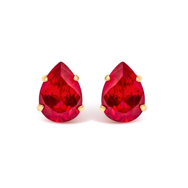 A whisper of modern romance, these pear-cut ruby studs paint the earlobe with a drop of radiant red—sleek, saturated, and...