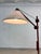 This Danish floor lamp from the 1970s is a striking example of the fusion of Scandinavian aesthetics and sophisticated...