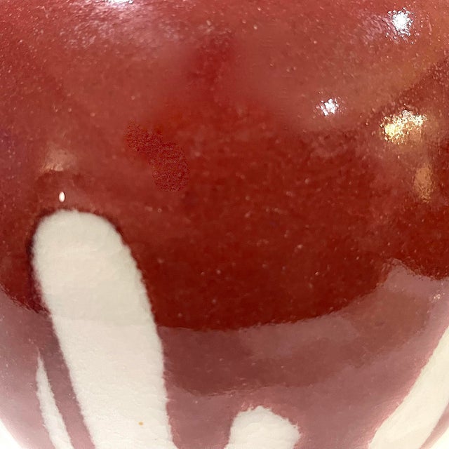 1980's hand-crafted studio porcelain pottery vessel with distinctive "nipple" top opening. . The white shiny glazed body...