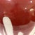 1980's hand-crafted studio porcelain pottery vessel with distinctive "nipple" top opening. . The white shiny glazed body...