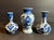 Vintage grouping of three small blue & white delft pottery bud vases. All are hand painted and signed on the bottom. Sizes...
