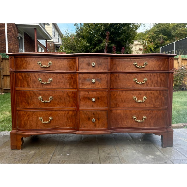 Elegant mahogany triple dresser by premium American furniture manufacturer, Kindel Grand Rapids. This richly figured...