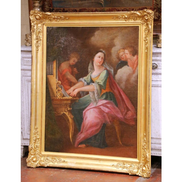 This large and refined antique French oil on canvas dates to the 18th century, circa 1750, and is executed in the Rococo...