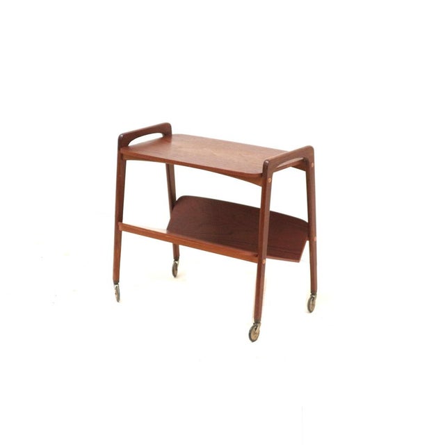 Vintage teak serving trolley side table with magazine rack by Opal, 1960s. This charming vintage serving trolley by Opal...