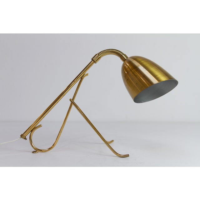 Swedish Brass Table Lamp with Flexible Neck, 1950s. Scandinavian Mid-Century Modern table lamp in solid brass with...