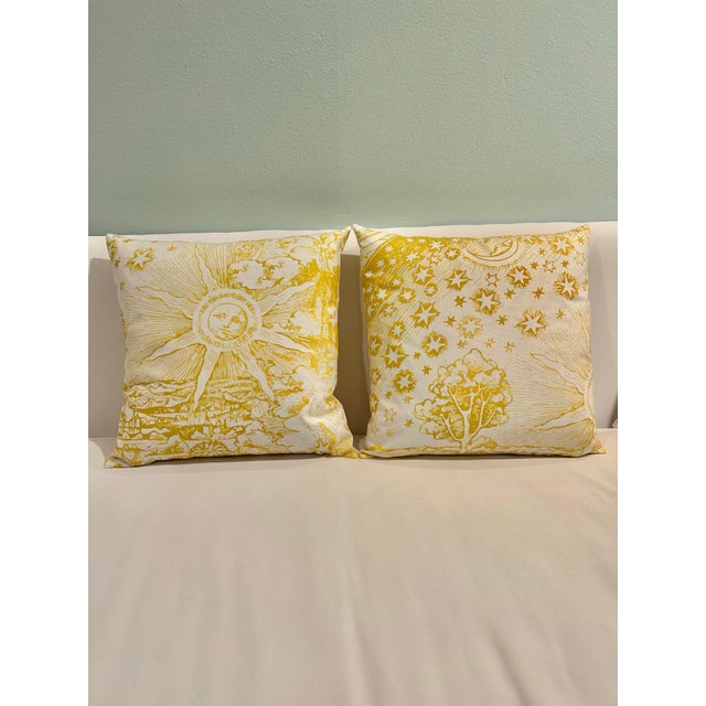 This pair of down filled pillows features Schumacher “Modern Toile” cotton fabric in yellow. The pattern is part of the...