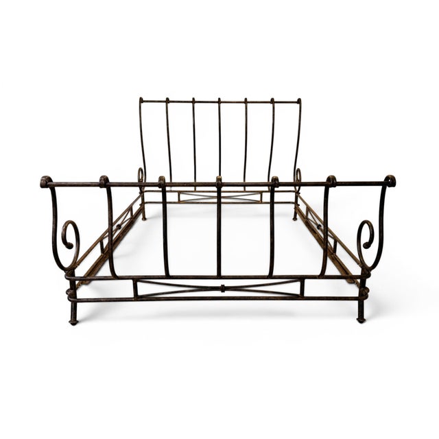 An exceptional and rare vintage wrought iron queen-size sleigh bed frame from the highly collectible Autumn Guild interior...