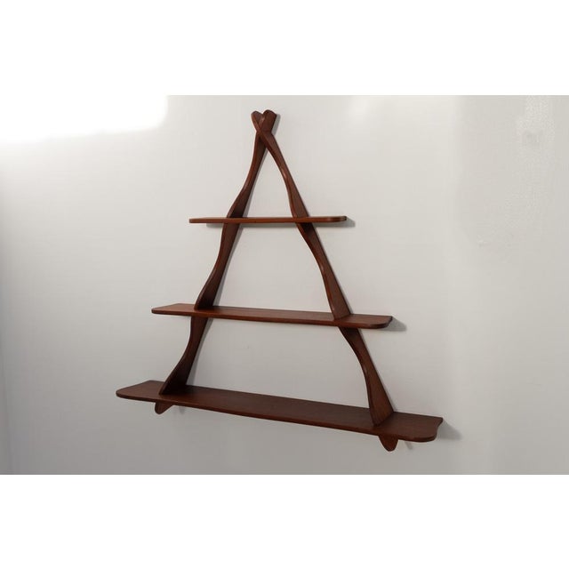 Danish Teak Shelf attributed to Peder Moos, 1950s. Scandinavian Mid-Century Modern triangular shelving unit in solid teak....