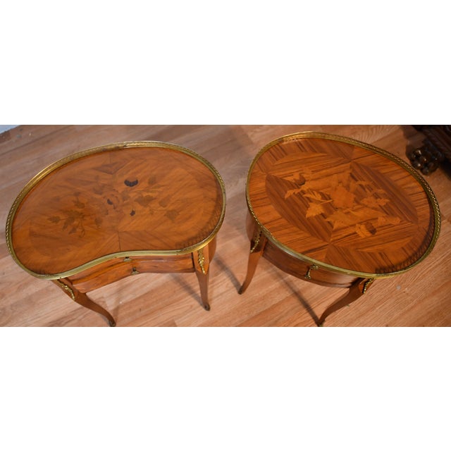 We are pleased to offer this beautiful pair of French Style nightstands , from the 1930s. This pair is made of Satinwood,...