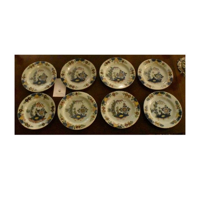 A set of English Delft bowls, 9 inch diameter. It's rare to find a set of eight of these 18th century plates with...