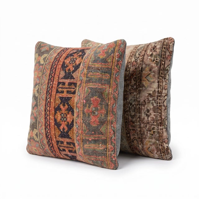 This 24'' x 24'' pillow cover set was made from authentic Turkish rug pieces — faded tribal bands in dusty pink, navy and...
