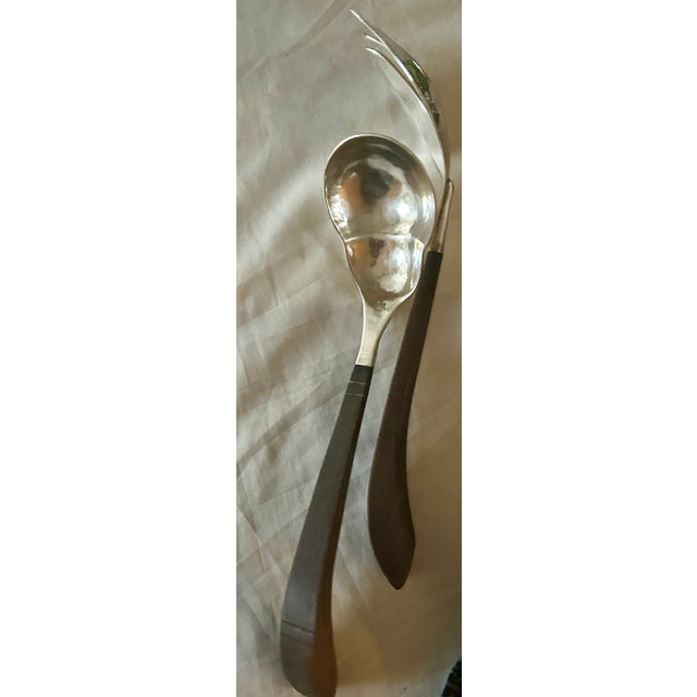 A striking pair of early Mexican Modernist salad serving utensils (fork and spoon) hand-crafted in Taxco, Mexico, during...