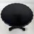 An elegant 19th-century French side table, distinguished by its sophisticated ebonised finish, finely executed brass...
