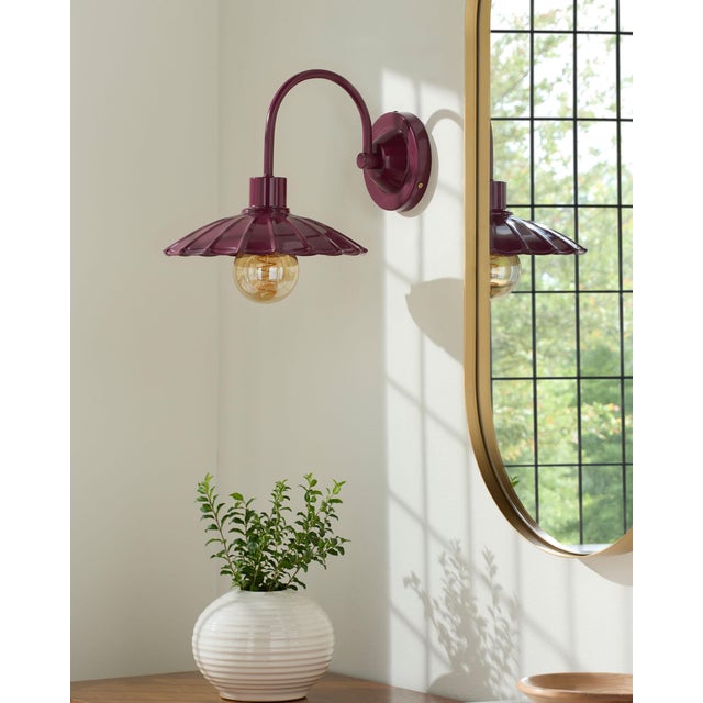 Illuminate your space with the rugged charm of the Pavona wall sconce lighting, where industrial meets rustic in a...