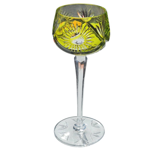 Standing at an impressive 8.25 inches, this exquisite piece boasts deep cuts, a faceted stem, and a starburst footing,...