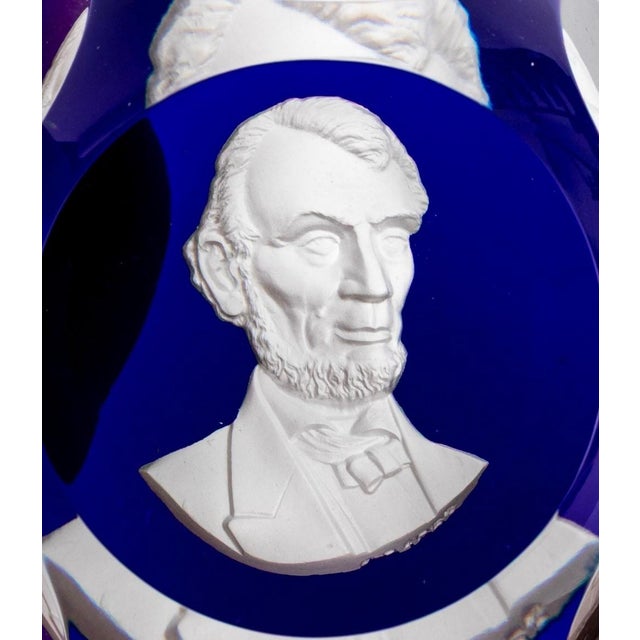 A striking mid-20th century Baccarat crystal sulfide paperweight, dated 1955, featuring a finely sculpted cameo portrait...