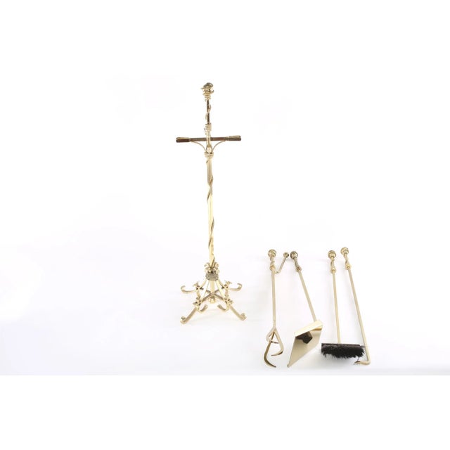 Mid 20th century Italian five piece brass fireplace tool set accessories with exterior design details. All together five...
