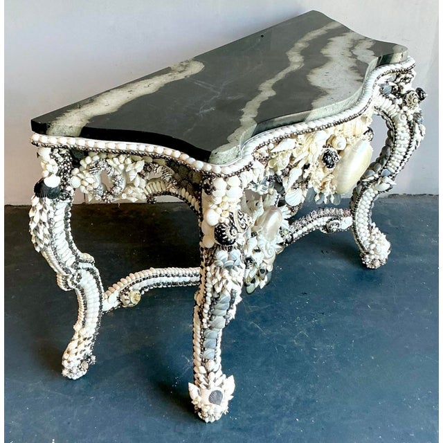 This extraordinary console table is a masterpiece of "Coquillage" art, embodying the whimsical luxury of the Coastal...