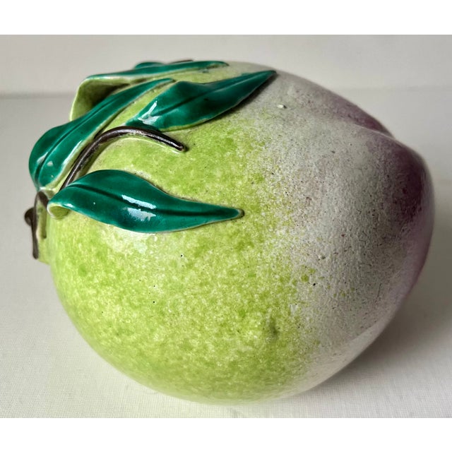 This gorgeous Chinese pottery peach 'altar fruit' (traditionally left as an offering at a shrine) features a light Green...