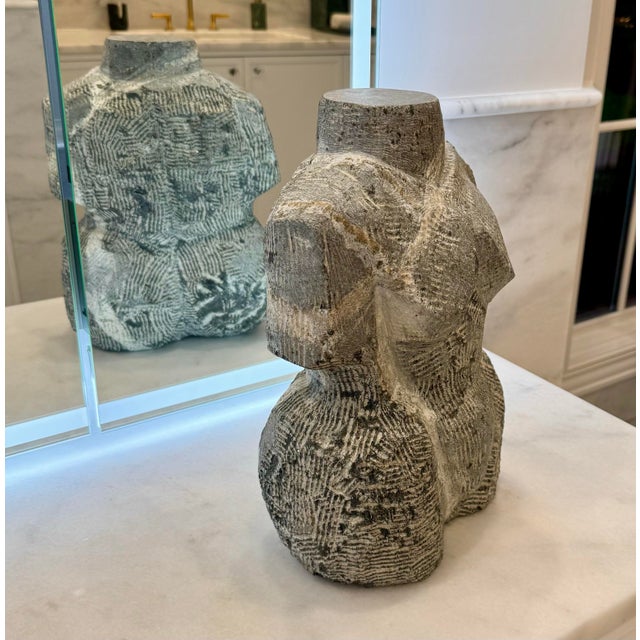 A stunning vintage hand-carved granite sculpture depicting an abstract female torso, executed with exceptional texture and...