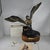 This handcrafted bronze sculpture depicts a mallard in mid-flight, mounted on a polished wooden base with an engraved...