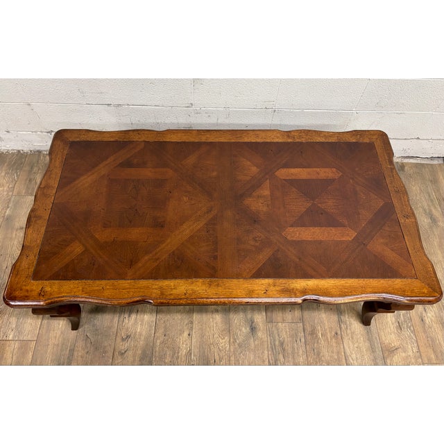 This is a gorgeous vintage French Louis XV style oak parquetry coffee table or cocktail table by Universal Furniture....