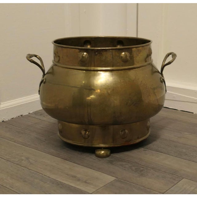 19th century pot belly brass coal bucket on feet This is a lovely big beaten brass coal or log bucket, it has a good...