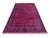 Afghan Turkmen rug, hand knotted in Afghanistan from 100% wool. Measuring 6’7” x 9’8”, this rug features a vibrant red...