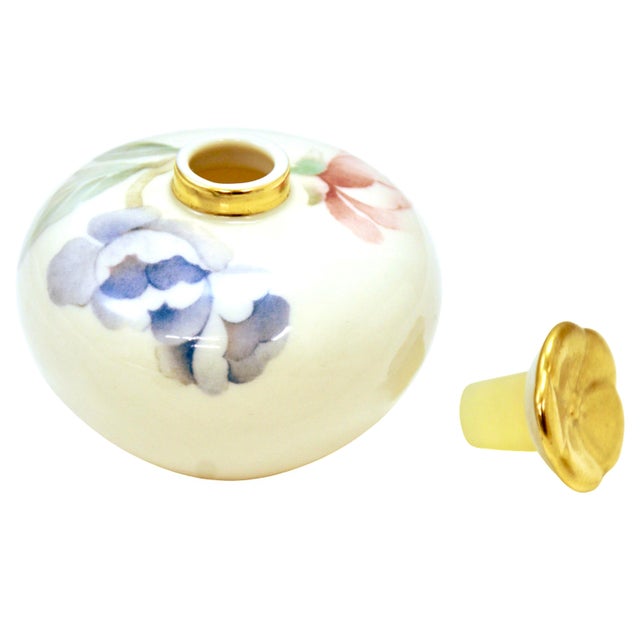 Vintage Lenox porcelain perfume bottle in the "Chatsworth" floral pattern in peach, pink, blue, and sage green as well as...