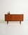 Teak sideboard with four drawers, ample storage, and a pull-out shelf. Scandinavian production from the 1960s. The clean...